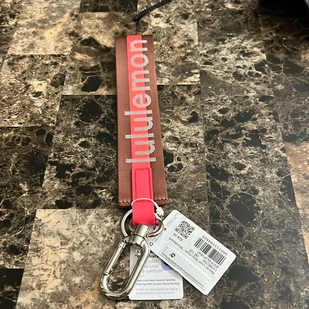 LULULEMON NEVER LOST KEYCHAIN ORANGE AND BROWN COLOR NWT
